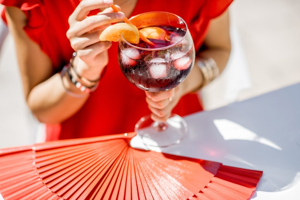 Woman with glass of Sangria drink